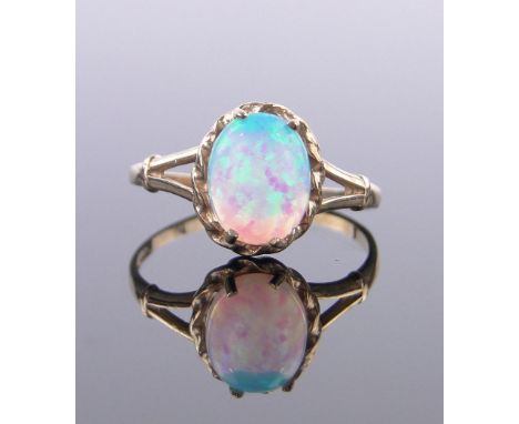 A 9ct gold opal set ring,opal 9mm x 7mm, size L.