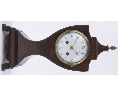 An Edwardian mahogany cased shield shaped mantel clock,with inlaid banded edges and enamelled dial, striking movement, height