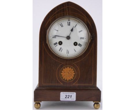 An Antique French mantel clock in inlaid mahogany case,on ball feet, height 10.5".