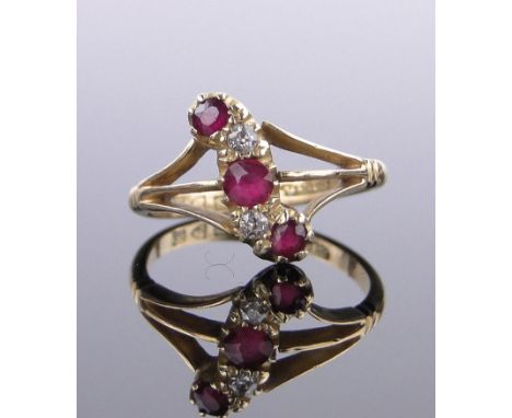 An Edwardian 18ct gold 5 stone ruby and diamond ring,hallmarks Chester 1910, setting height 14mm, size K.