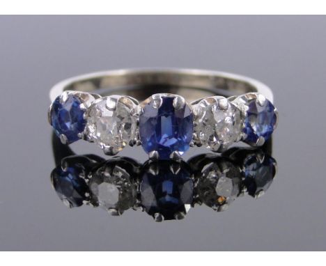 An 18ct gold and platinum 5 stone sapphire and diamond ring,setting width 20mm, size P.