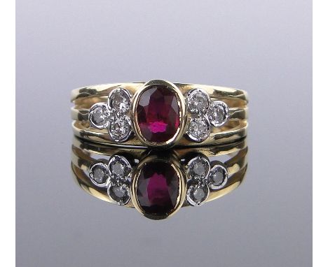 An 18ct gold ruby and diamond set ring,setting height 7mm, size N.