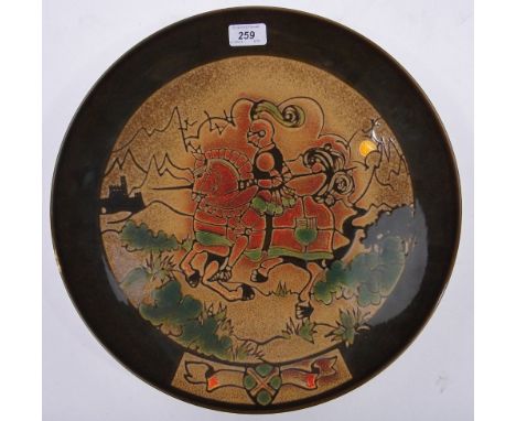 A Poole Pottery Aegean charger,signed L Lagarowicz with medieval knight on horseback design, diameter 16".