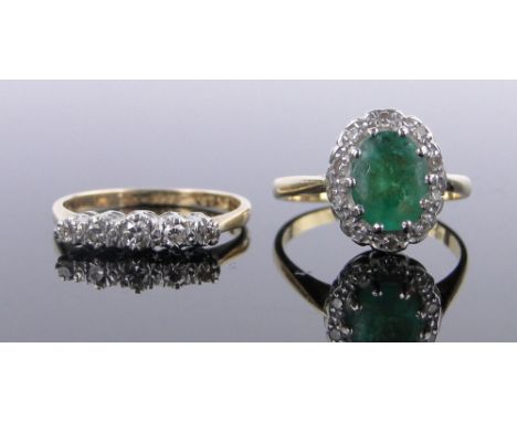 An 18ct emerald and diamond cluster ring,and an 18ct 5 stone diamond ring, (2).