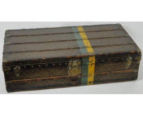 An Antique Louis Vuitton wood and brass bound travelling trunk,with original brass locks and paper label inside, length 3'8",