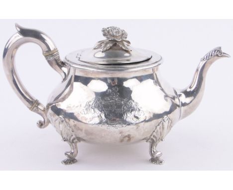 A George IV silver teapot,on cast feet, makers marks W E, London 1826, 27 oz.