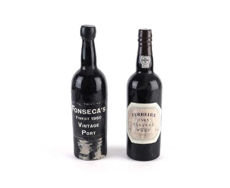 A bottle of Fonseca’s Finest Vintage Port, bottled in 1960, together with a bottle of Ferreira Vintage Port, bottled in 1985.