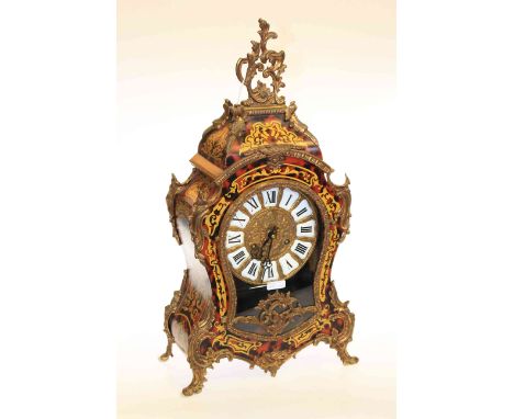French simulated red boule mantel clock with ormolu mounts, the gilt dial having enamel Roman numerals