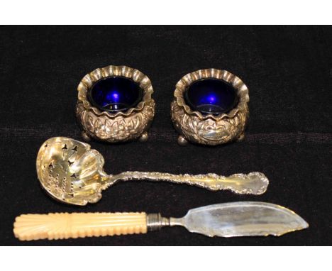 Pair of Victorian silver salts, silver sifting ladle and a silver butter knife (4)