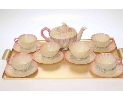 Six Belleek tea cups and saucers with matching teapot