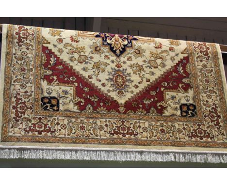 Heriz carpet with a beige ground 230cm x 160cm 