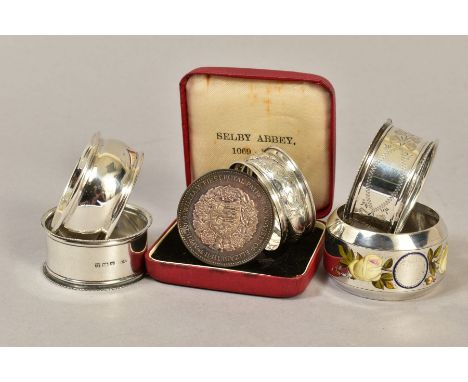 VARIOUS SILVER CIRCULAR NAPKIN RINGS, including a late Victorian example with enamelled floral decoration, maker William Hatt