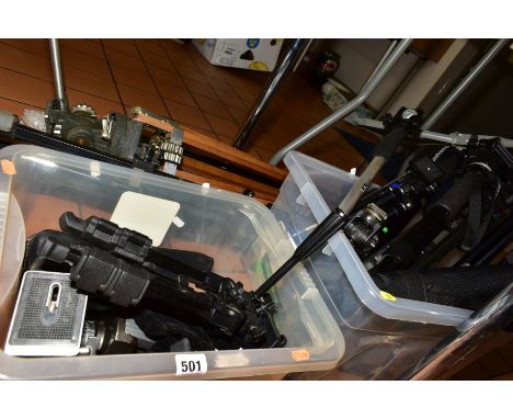 TWO TRAYS CONTAINING CAMERA TRIPODS AND MONOPODS, including Manfrotto, Slik, Jessops Velbon and a vintage wooden tripod stamp