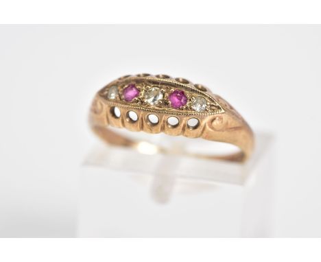 AN EARLY 20TH CENTURY 9CT GOLD, RUBY AND DIAMOND BOAT RING, set with a central single cut diamond interspaced with circular c