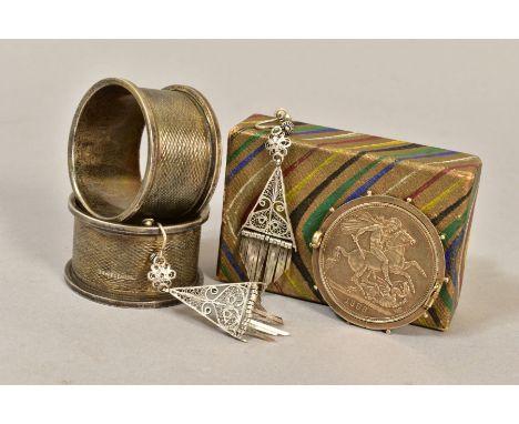 A PAIR OF GEORGE VI SILVER CIRCULAR NAPKIN RINGS, engine turned decoration, together with a Victorian 1888 silver crown mount