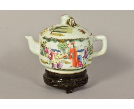 A 20TH CENTURY CHINESE PORCELAIN FAMILLE ROSE TEAPOT, of circular form, with peach finial, decorated with figures in landscap