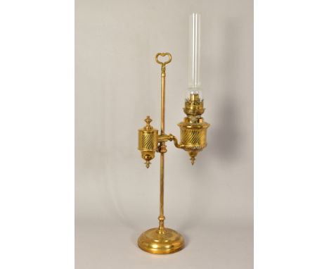 A LATE 19TH/EARLY 20TH CENTURY FRENCH BRASS OIL LAMP, on a height adjustable column with carrying loop to the top, weighted c