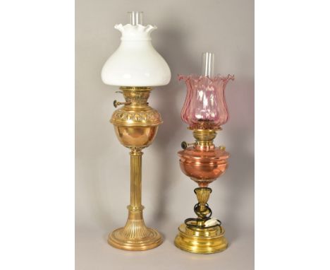 AN EARLY 20TH CENTURY HINKS &amp; SONS BRASS BASED OIL LAMP, with chimney, plain white opaque shade, embossed egg and dart ba