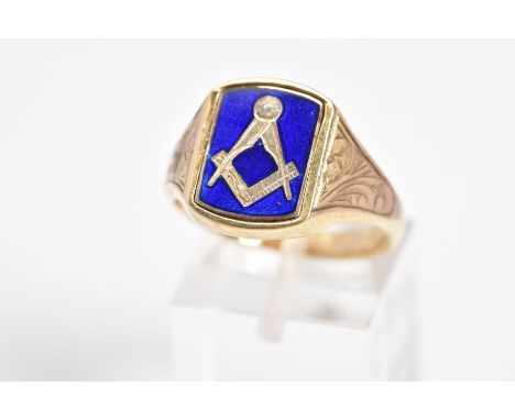 A 9CT GOLD MASONIC SIGNET RING, the curved rectangle panel features a blue enamel Masonic emblem, swivels to show a plain pol