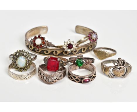 A SELECTION OF JEWELLERY, to include eleven rings such as two silver opal and garnet cluster ring, both with silver hallmarks