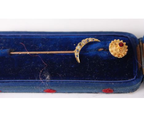 A continental 18ct gold and ruby set stick pin; together with a yellow metal, sapphire and diamond set stick pin in elliptica