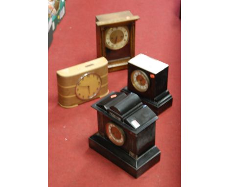 A late Victorian black slate cased mantel clock, having enamelled chapter ring with Arabic numerals, eight day movement; toge