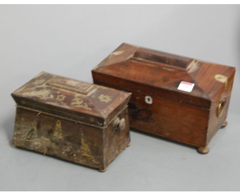 A Victorian rosewood tea caddy, of sarcophagus form, having three compartment interior, on bun feet, flanked by ring handles,