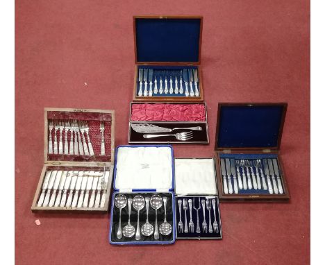 Assorted cased flatwares to include a set of 12 mother of pearl handled dessert knives and forks, one other set in walnut cas