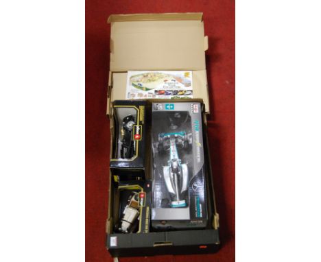 A collection of boxed modern issue diecast scale models, to include Maisto radio controlled Formula 1 team car, Bburago Merce