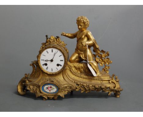 A late 19th century French gilt metal mantel clock, the circular enamel dial with Roman numerals signed Leeroy Paris, having 