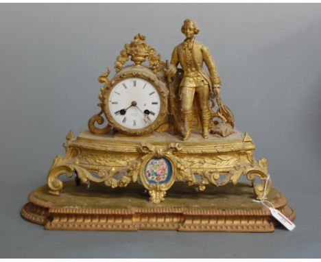 A late 19th century French gilt metal mantel clock having a circular dial with Roman numerals signed Henry Marc a Paris, with
