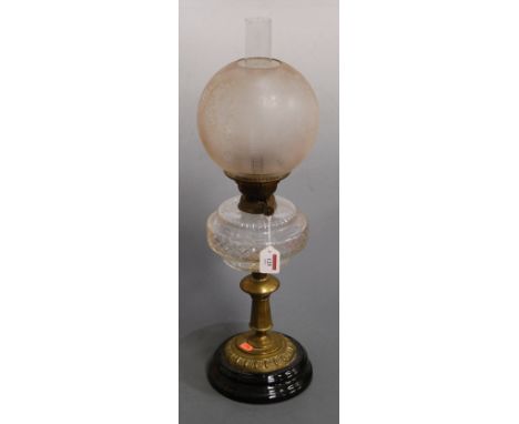 A Victorian oil lamp, having opalescent glass shade above a clear glass font, on brass pedestal and socle base, h.58cm