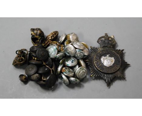 A Kings Crown black police helmet badge for the Isle of Ely Constabulary; together with various Isle of Ely Constabulary butt