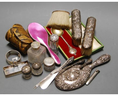 A box of miscellaneous items to include silver topped dressing table jars, shoe horn, silver bangle, brushes etc. Cased silve