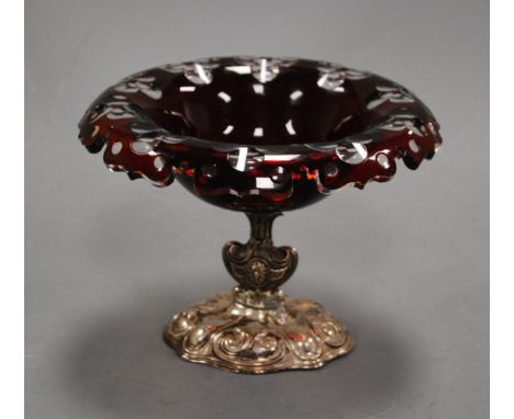 An early 20th century Bohemian ruby overlaid glass bowl, of circular form, within shaped border, on associated white metal we