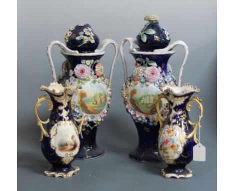 A pair of large late 19th century continental porcelain floral encrusted twin handled vases and covers, each central panel de