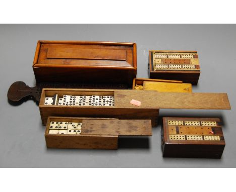 A Victorian yew wood games box containing a rosewood crossbanded cribbage board, various gaming counters, together with vario