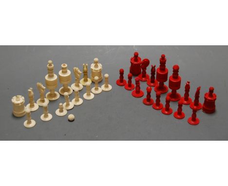 A 19th century turned bone chess set, with one side being natural bone and the other being dyed red, king h.10cm