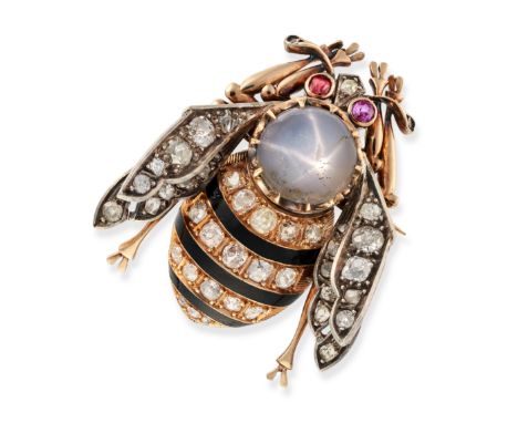 AN ANTIQUE STAR SAPPHIRE, DIAMOND, RUBY AND ENAMEL BEE BROOCH in yellow gold and silver, designed as a bee set with a round c