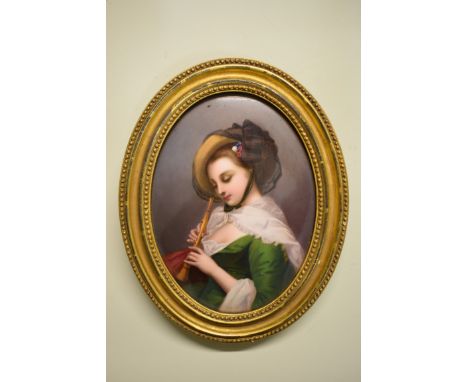 A KPM porcelain plaque, painted with a lady playing a recorder, impressed marks, 17.5 x 13cm oval.&nbsp; 
