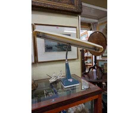 A vintage articulated desk lamp. 
