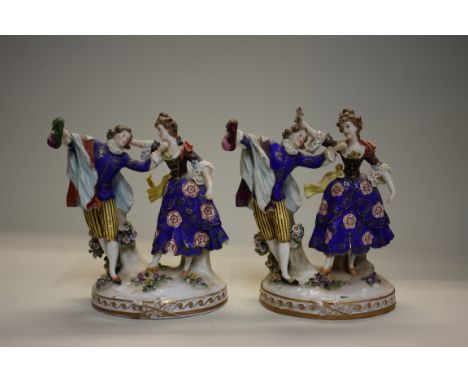 Two similar Sitzendorf porcelain figure groups, 21cm high. 