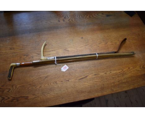 An antler handled malacca cane; together with another antler handled riding crop, both with silver mounts; and another milita
