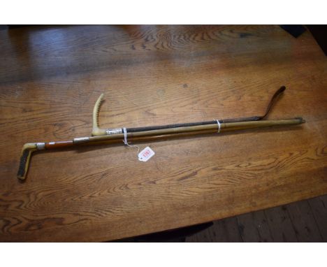 An antler handled malacca cane; together with another antler handled riding crop, both with silver mounts; and another milita