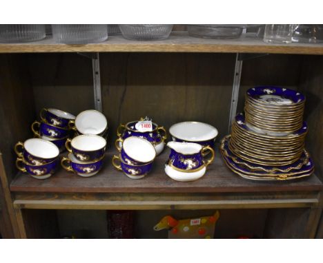 A Royal Crown Derby part tea service,&nbsp;the plates and saucers with elaborate monogram. 