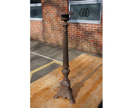 A large old Continental cast iron pricket candlestick, 70cm high.&nbsp; 