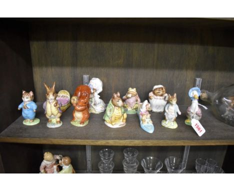 Eleven Beswick Beatrix Potter figures, comprising: 'Mr Benjamin Bunny', second version, lilac jacket, BP-2b; 'Squirrel Nutkin