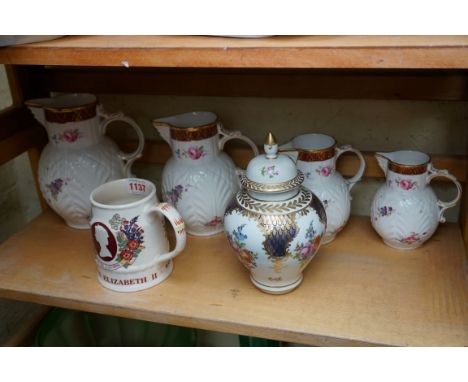 A graduated set of four Coalport 'Caughley Mask-Head' jugs; together with a Dresden vase cover; and a Mason's Silver Jubilee 