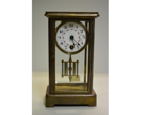 An unusually small late 19th/early 20th century brass four glass mantel timepiece,&nbsp;with enamel dial and mercury pendulum