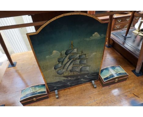 An old painted wood firescreen, decorated with a galleon, 63cm high; together with a similar graduated pair of dome top caske